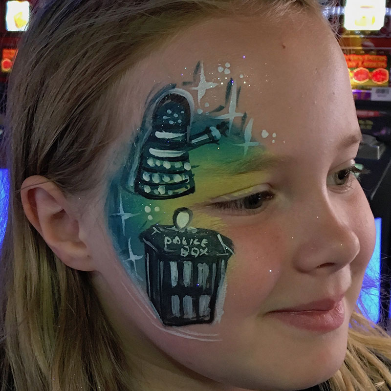 Girl facepaint with playful design